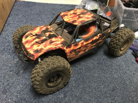 1989 Ford Bronco - This remote control rock crawler features a distinctive flame graphic design on its body.