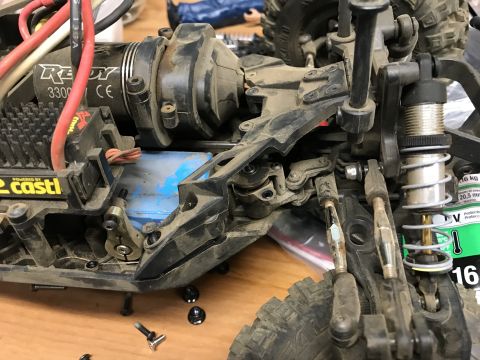 1989 Ford Bronco - Close-up of an RC car's chassis, highlighting its motor and suspension components.