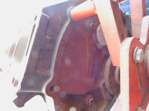 1968 Mercury Cougar - Close-up view of a corroded engine block with visible bolts and orange structural supports.