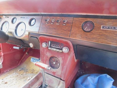 1968 Mercury Cougar - The interior of a 1968 Mercury Cougar shows its dashboard with various gauges and a vintage radio.