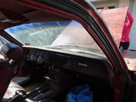 1968 Mercury Cougar - The interior of a 1968 Mercury Cougar shows a wood-grain dashboard with multiple gauges and the model name clearly visible.