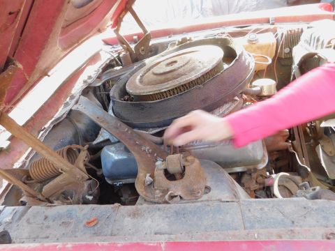 1968 Mercury Cougar - Close-up view of a car's engine bay, focusing on the air cleaner assembly and engine components.