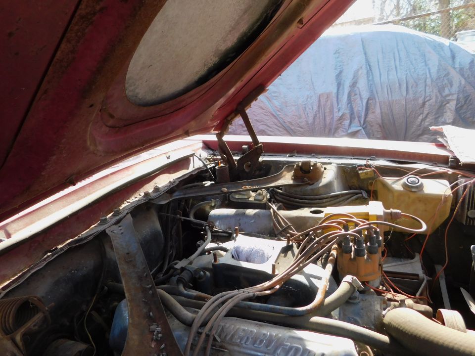 1968 Mercury Cougar engine bay with hood open, showing V8 engine and wiring