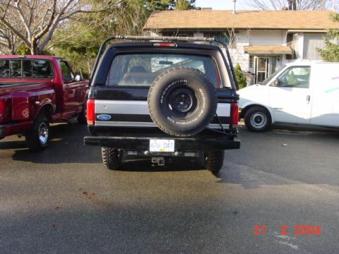 1995 Ford Bronco - Rear view of a 1995 Ford Bronco, showing its spare tire mount and license plate.