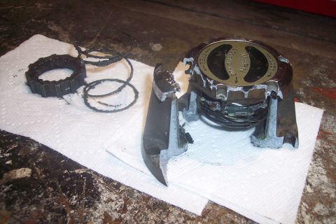 1973 Ford F-250 - Disassembled and broken manual locking hub assembly, showing internal gears and springs.