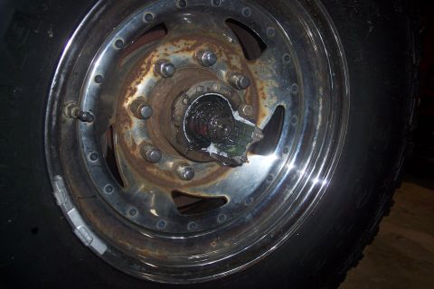 1973 Ford F-250 - This image shows a close-up of a truck's wheel hub, showing rust and some grease.