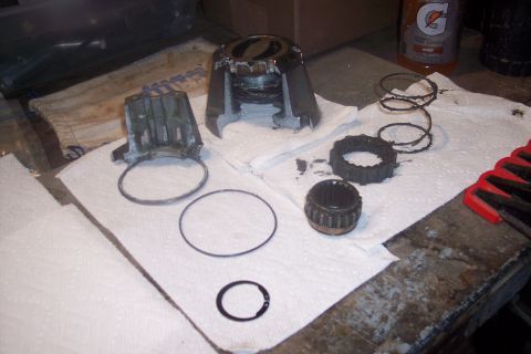 1973 Ford F-250 - Hub components disassembled for service, including a bearing, gears, and springs.