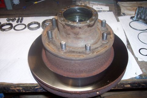 1973 Ford F-250 - Front wheel hub and brake rotor assembly with associated bearing parts.