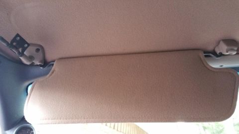 1996 Ford Bronco - Interior view of a 1996 Ford Bronco's sun visor and headliner.