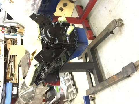 1964 Ford Galaxie - Engine block, possibly from a 1964 Ford Galaxie, is mounted on an engine stand for work.
