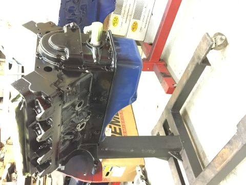 1964 Ford Galaxie - Engine block on a stand, possibly undergoing restoration or rebuild.