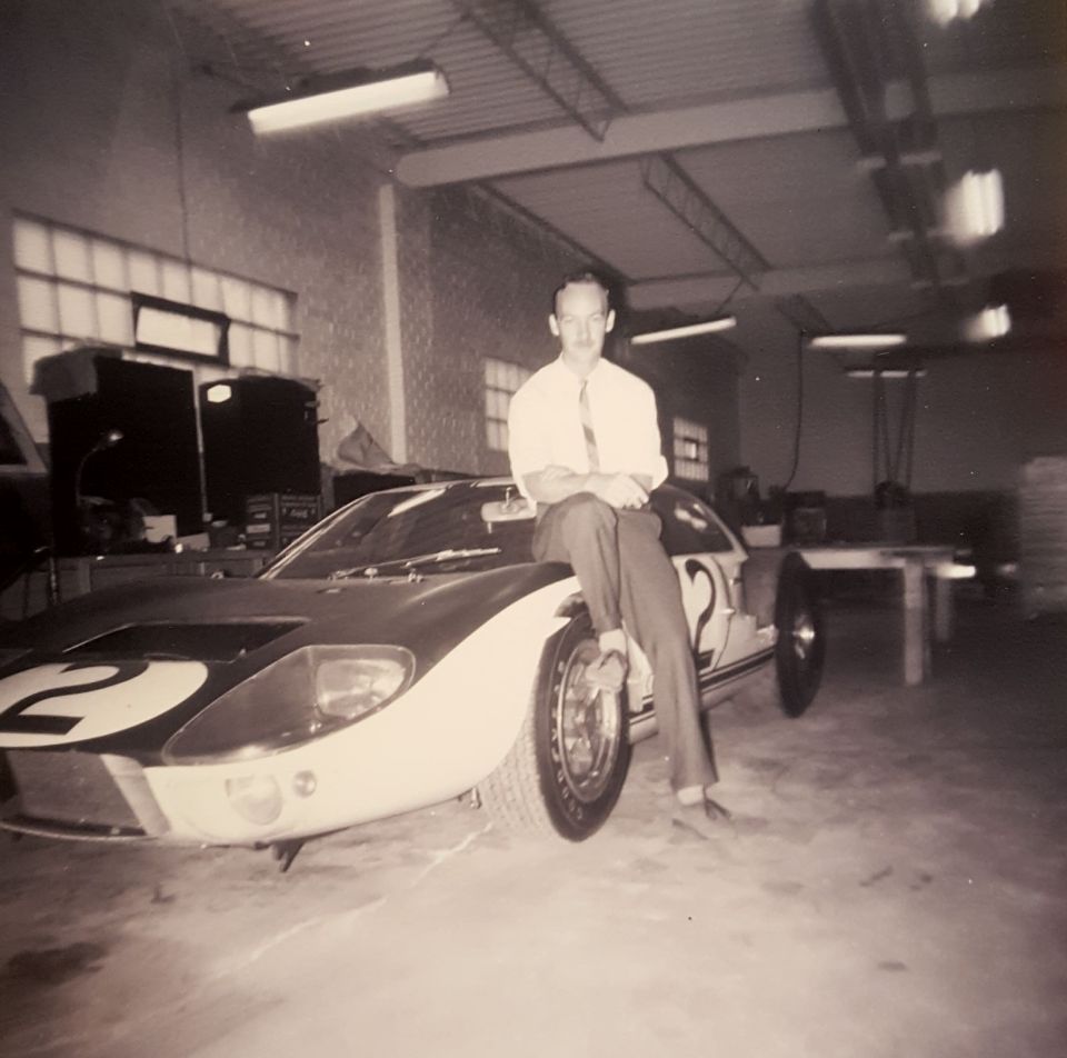 Ford GT40 with racing number 2, man sitting on hood