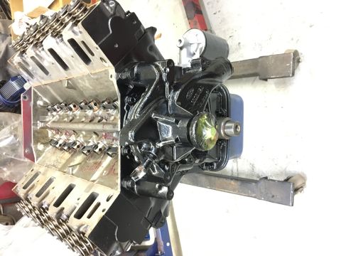 1964 Ford Galaxie - Close-up view of an engine block, showing pistons and the crankshaft pulley assembly.