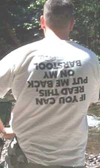 1979 Ford Bronco II - Man wearing a t-shirt with a humorous message and a Supermotors logo.