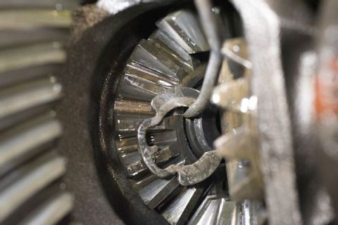 1996 Ford Bronco - A close-up view shows the internal gears of a differential, likely from a 1996 Ford Bronco. The metal gears are lubricated with oil, and a…