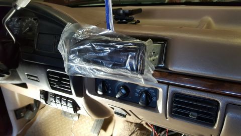 1996 Ford Bronco - Interior view of a 1996 Ford Bronco dashboard, showing the radio unit still in its protective plastic packaging.