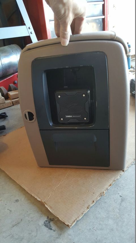 1996 Ford Bronco - Center console removed from a vehicle, showing an installed Uniden device.