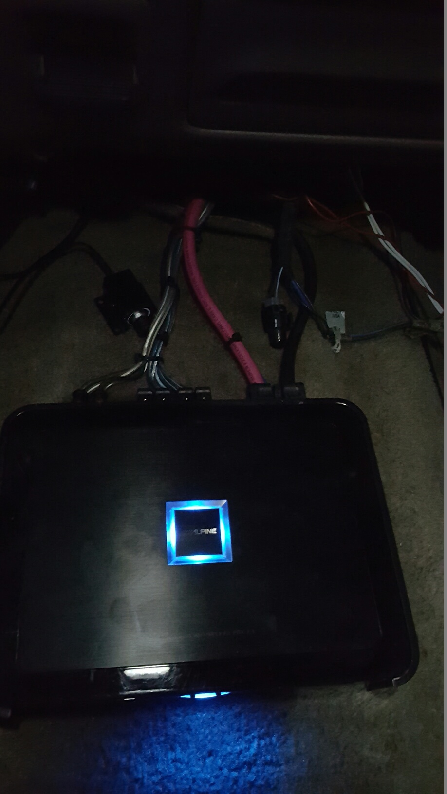 car amplifier with blue light and wires connected