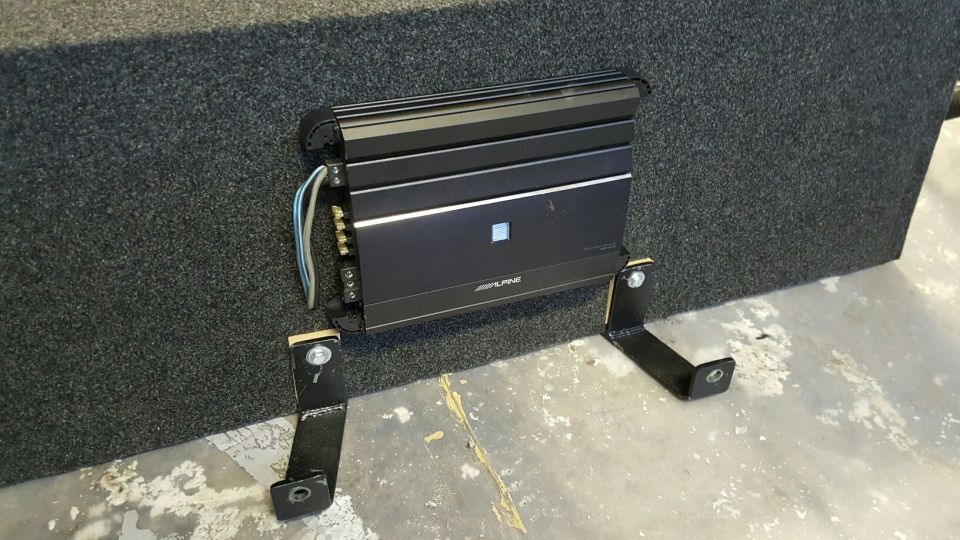 Alpine amplifier on subwoofer box