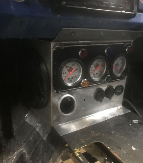1974 Ford Bronco - Interior view of a custom dashboard multiple gauges and power outlets, with a 'Supermotors.net' watermark visible.