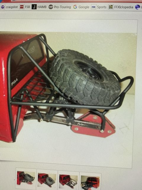 1989 Ford Bronco - This is a close-up of a red RC car's rear bumper and spare tire carrier assembly.