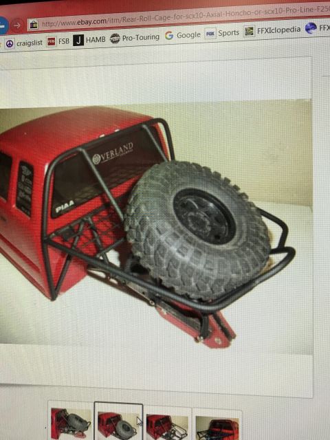 1989 Ford Bronco - This is a red RC truck body with a custom roll cage and spare tire.