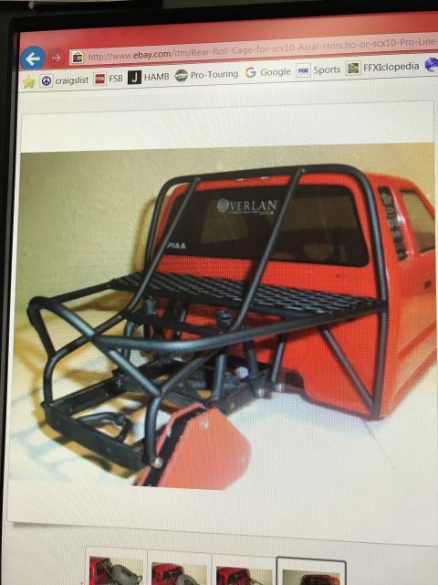 1989 Ford Bronco - RC car body with a custom roll cage and rack, showing Overland and PIAA branding.