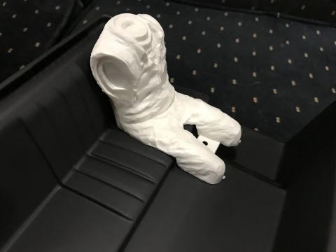 1989 Ford Bronco - A white, 3D printed object with a textured surface is placed inside a black container.