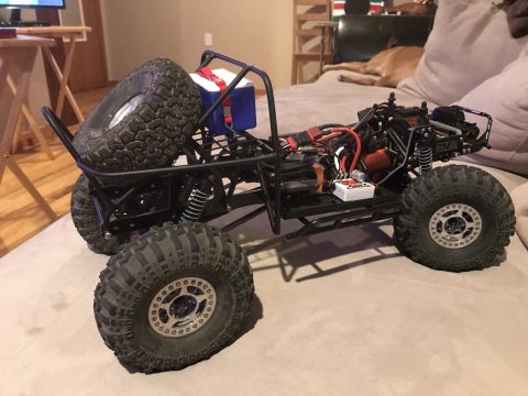 1989 Ford Bronco - This remote control rock crawler chassis is shown with its internal components and large off-road tires.