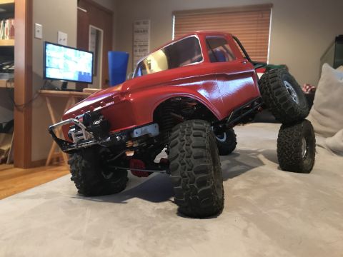 1989 Ford Bronco - This remote-controlled truck is positioned on a couch, its off-road capabilities.