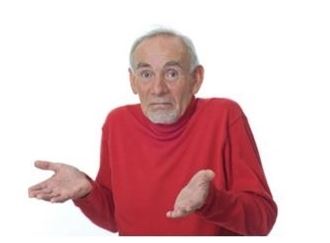 1996 Ford Bronco - An older man wearing a red turtleneck sweater shrugs with his hands outstretched, looking at the camera. The background is plain white.