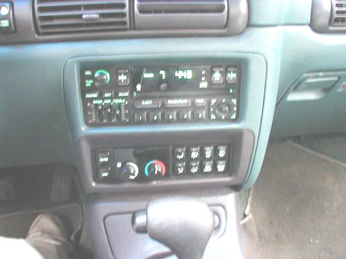 Interior dashboard of a 1995 Dodge Intrepid showing the radio and climate controls