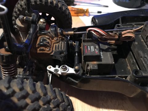 1989 Ford Bronco - A close-up view of the steering servo and receiver assembly on an RC car chassis. The Tactic TR325 3-channel receiver is visible, along wit…