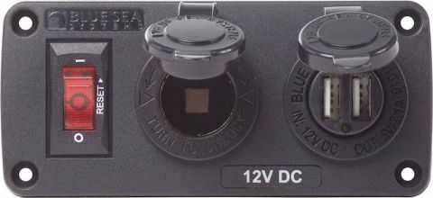 1981 Ford Bronco - A Blue Sea Systems 12V DC power distribution panel is shown, featuring a red reset switch, a 12V socket, and dual USB ports. The panel is m…