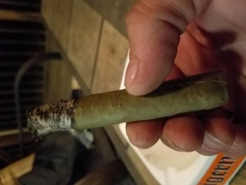 2018 Ford Bronco - A hand holds a lit cigar, with the Supermotors logo visible in the background.