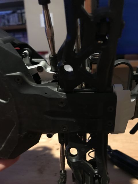 1989 Ford Bronco - Detail of RC car suspension assembly, showing plastic and metal parts.