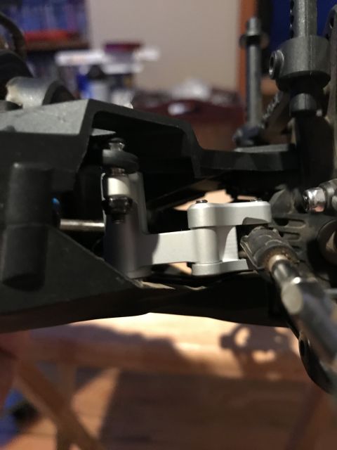 1989 Ford Bronco - Detailed view of the suspension system on a remote control car, showing intricate mechanical parts.