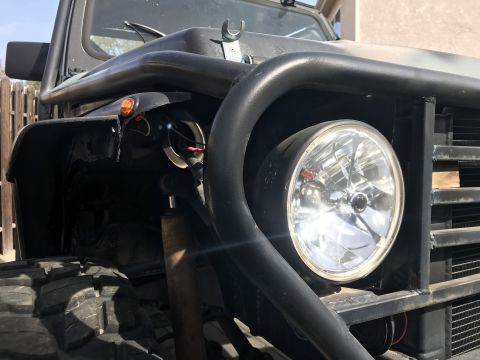 1987 Suzuki Samurai - A modified 1987 Suzuki Samurai shows off its off-road capabilities with large tires and a protective brush guard.