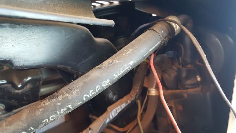 1973 Ford F-100 - Engine bay details with hoses and wiring visible. Text is marked on a hose.
