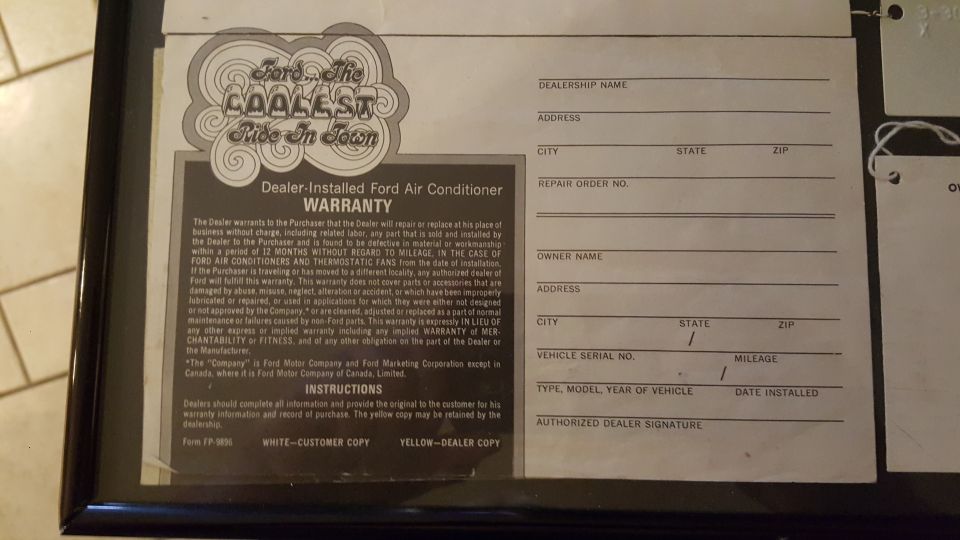 Ford air conditioner warranty document with "The Coolest Ride in Town" graphic