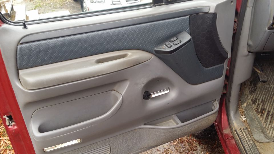 After. The panel is trashed and needs replacing so if I really messed up the panel I would not have felt too bad about it. I am still not completely sold on the scheme though. I mean I do not, not like it.
That dingy brown stained armrest looks even worse now. Blegh. Also keener eyes may have spotted the chrome door handle. Not a fan but I needed a metal handle as I kept breaking the plastic ones. This one was from a bullnose, IIRC. I did have to do the door handle fix...it was torn; badly.
