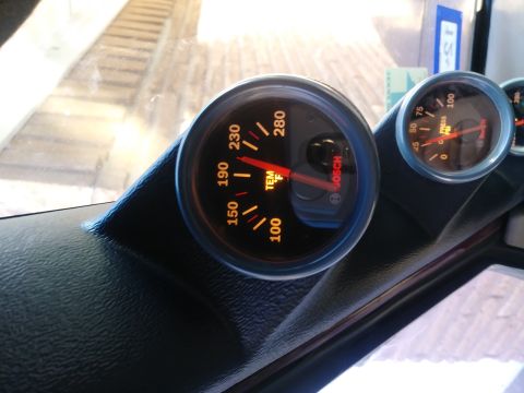 1996 Ford Bronco - Close-up of dashboard gauges, including a temperature gauge reading approximately 200 degrees Fahrenheit.
