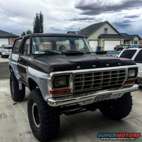 1979 Ford Bronco - This modified Ford Bronco features a lifted suspension and large off-road tires, with a two-tone paint scheme.
