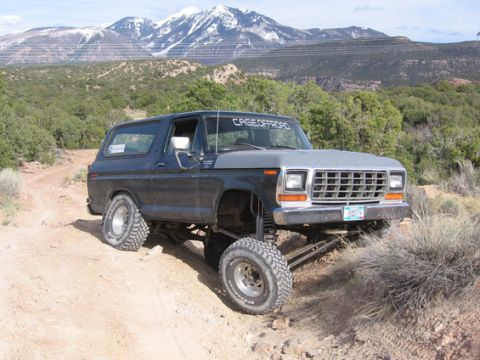 1979 Ford Bronco - This lifted 1978 Ford Bronco navigates a , off-road terrain with snow-capped mountains in the background.