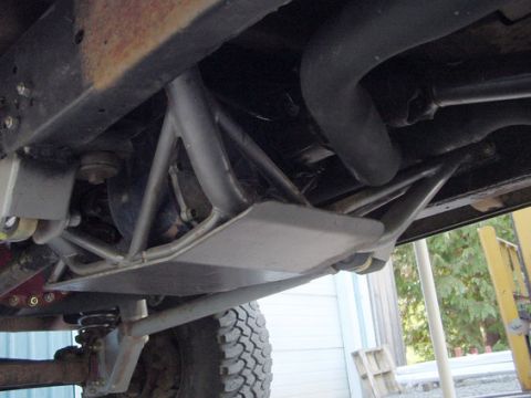 1979 Ford Bronco - The underside of a vehicle shows a custom skid plate and suspension components, not a stock 1979 Ford Bronco.