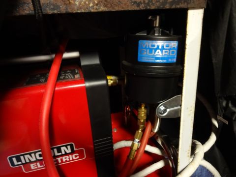 1967 Mercury Cougar - Close-up view of welding equipment including a Lincoln Electric welder and a Motor Guard air filter.