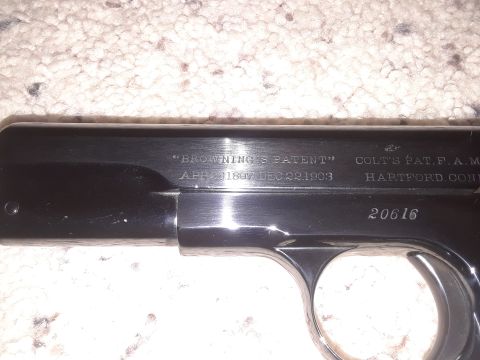 1994 Ford Bronco - Markings on a Colt pistol slide indicate Browning's patent and manufacturing details.
