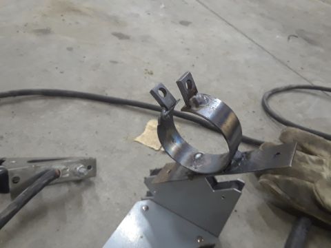 1985 Ford Bronco - Custom metal clamp part being held in a jig, ready for further work.