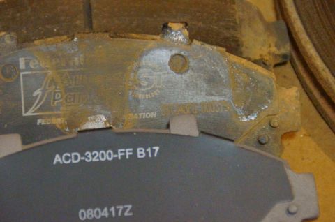 1998 Ford Ranger - Close-up of brake pads, one labeled Federal Auto Parts and the other showing part number ACD-3200-FF B17.