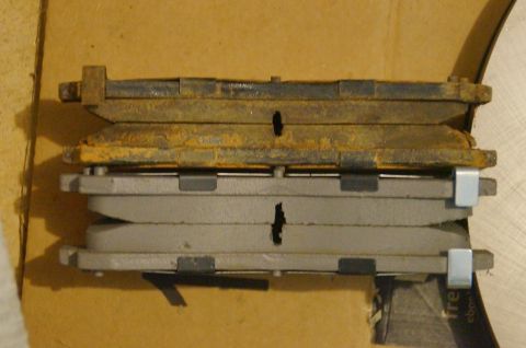 1998 Ford Ranger - Comparison of old and new brake pads, showing wear on the older set.